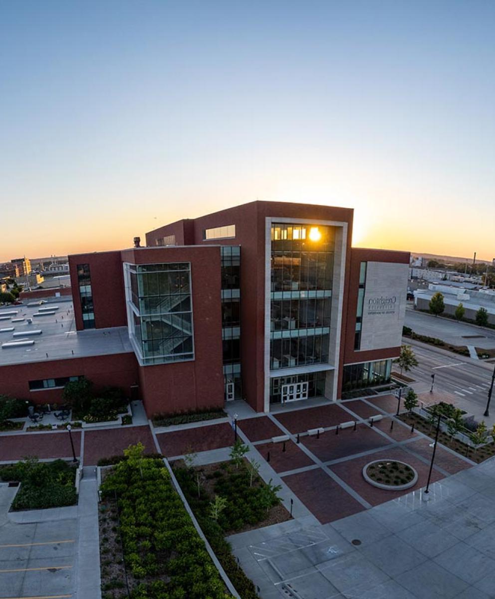 Dental college building with sunrise coming up on the horizon